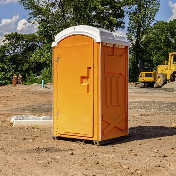 what is the cost difference between standard and deluxe portable toilet rentals in Gilchrist County